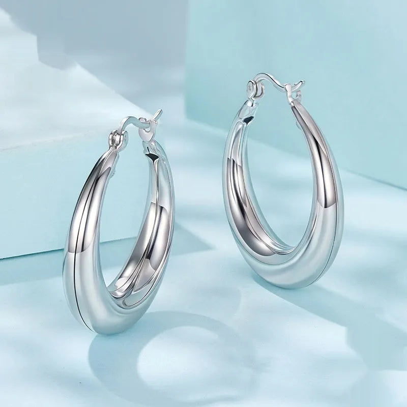Silver-tone geometric ring clip-on earrings for women, shown in three sizes.