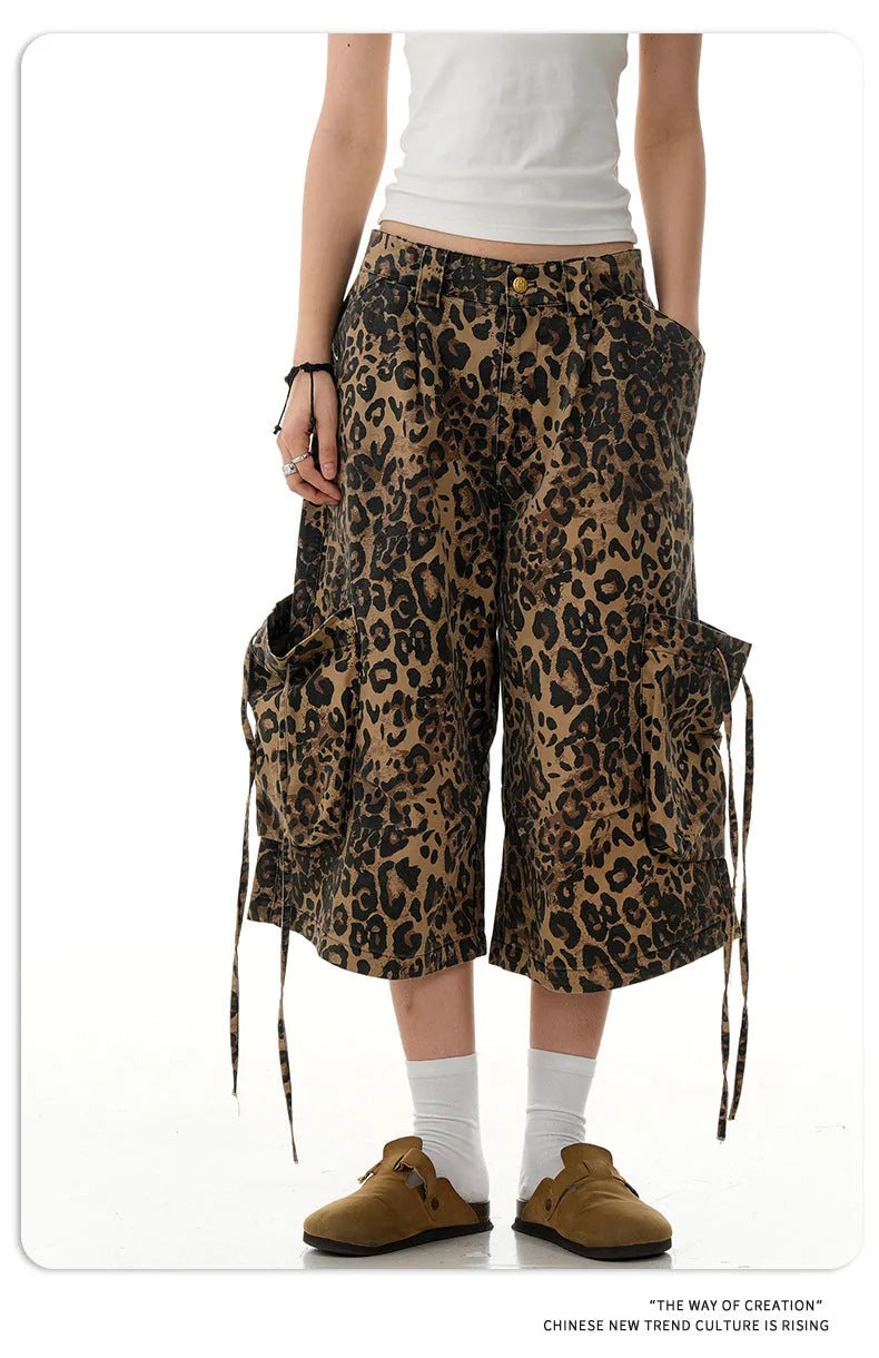 Leopard print women's trousers with high waist, button fly, and cropped straight-leg design