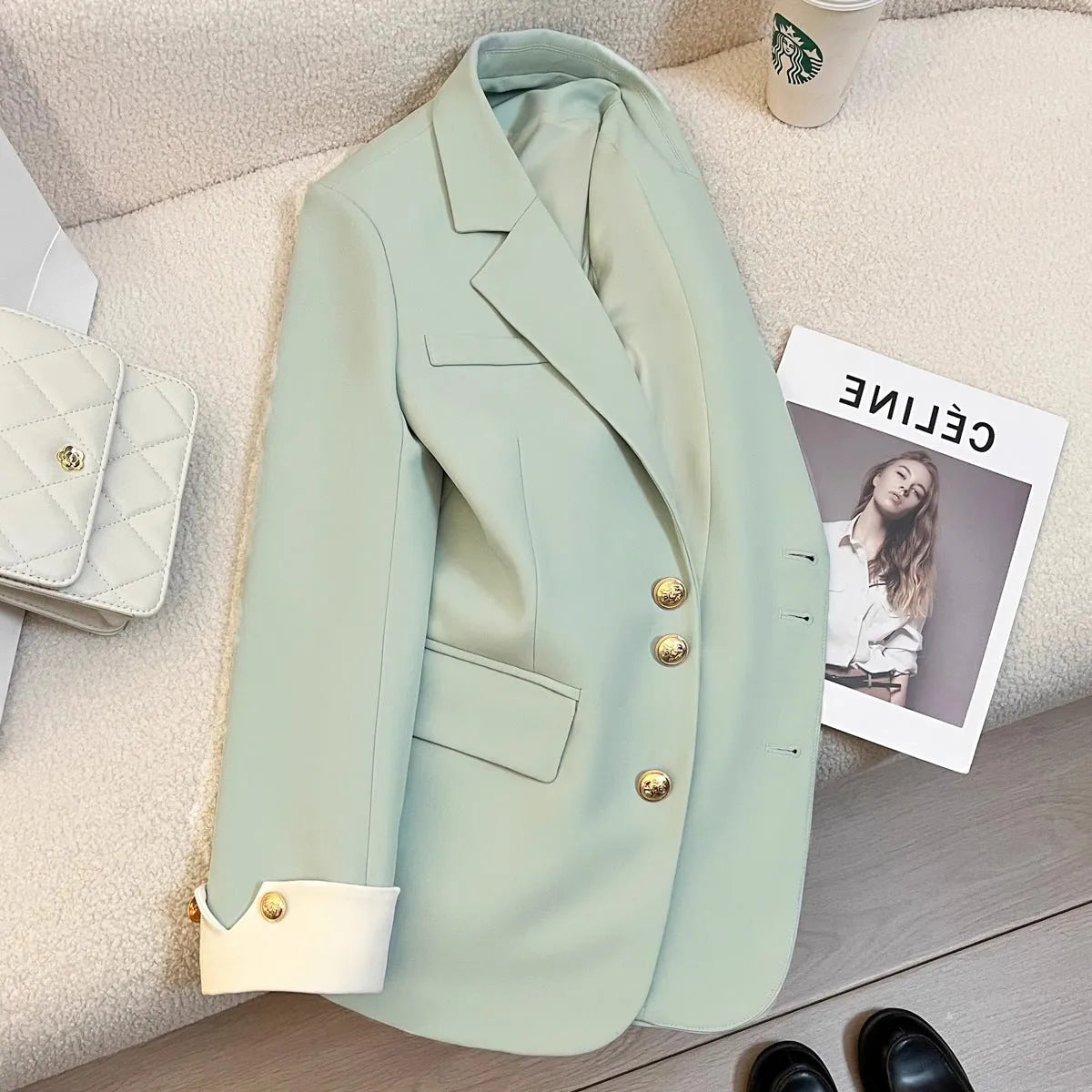 Korean-style loose fit women's trench coat in milky white with long sleeves and pockets.