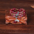 Handmade geometric bracelet made from natural watermelon crystal beads with Chinese knot closure.