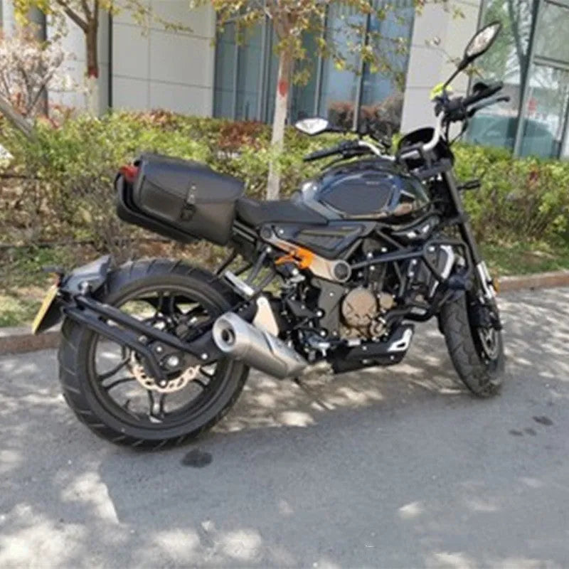 Black PU leather motorcycle swingarm side saddlebag mounted on a Sportster, showing its storage capacity.