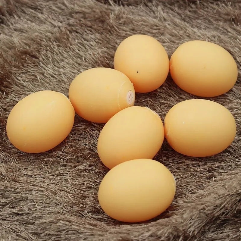 Egg-shaped dog chew toy with textured surfaces for dental cleaning and sound feature