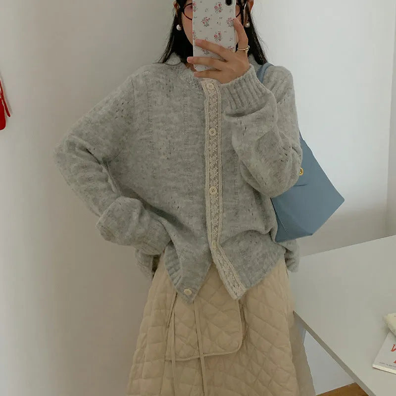 Loose artistic retro knitted cardigan coat in viscose fibre, shown in apricot colour.