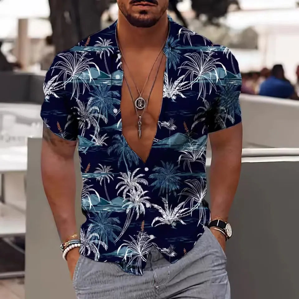 Man wearing a loose-fit short sleeve floral print shirt in a cardigan style on the beach.