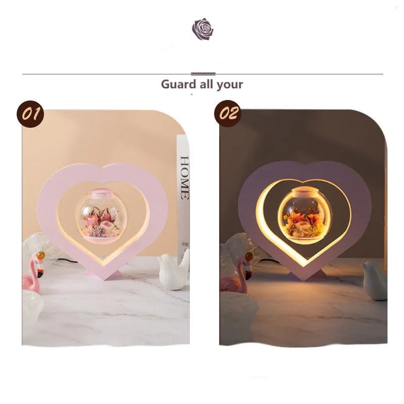 Pink preserved rose inside clear acrylic heart ornament with optional Bluetooth speaker base