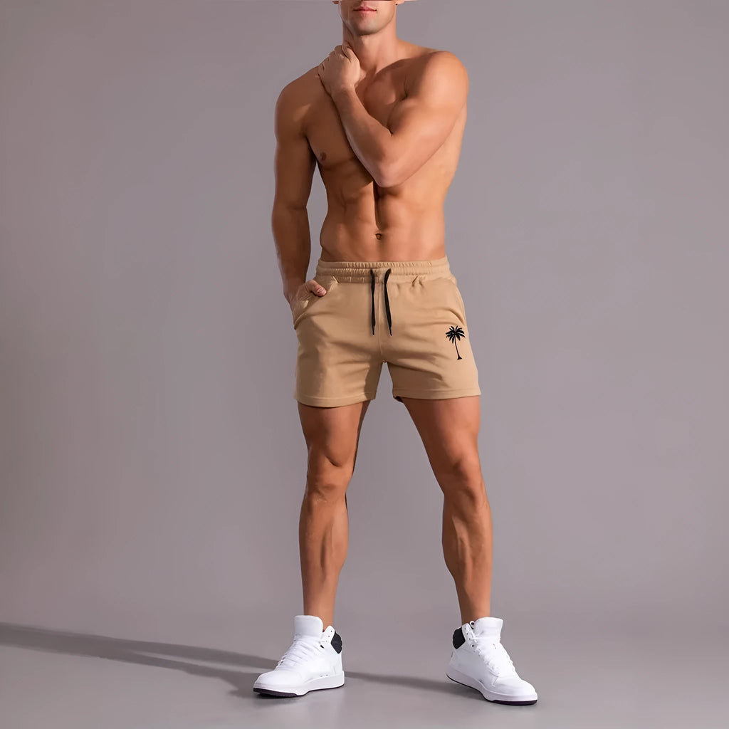 Man wearing khaki coconut print straight-leg sports shorts made of polyester