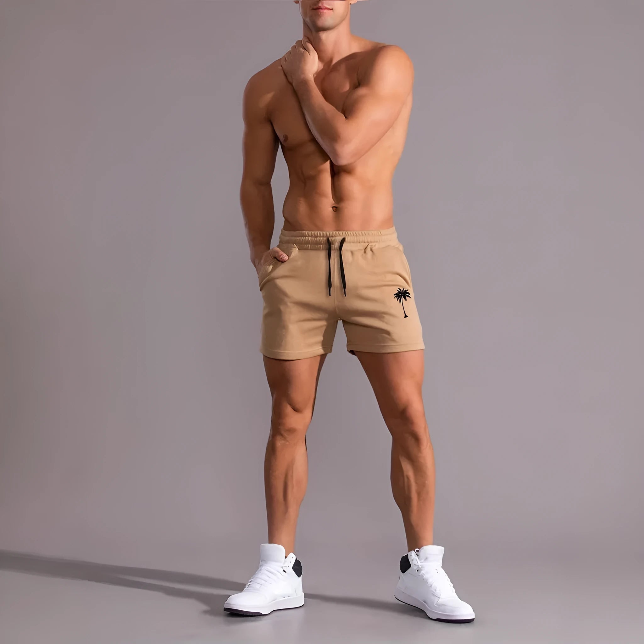 Man wearing khaki coconut print straight-leg sports shorts made of polyester