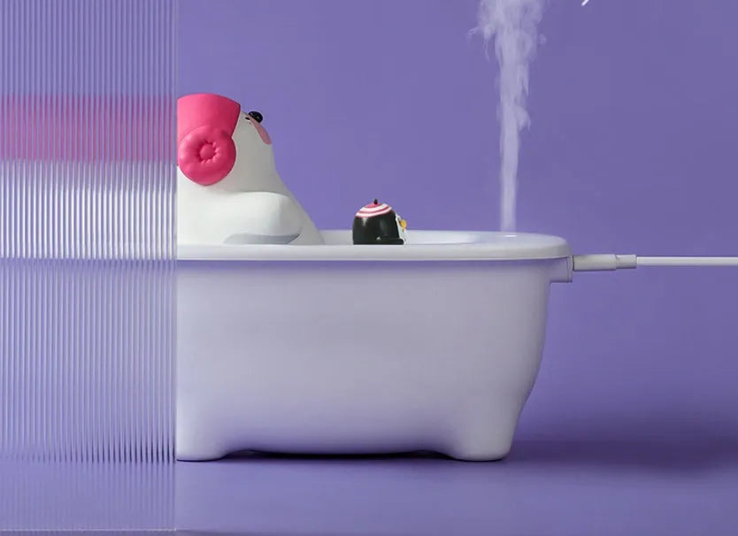 White USB air humidifier with 550ml tank and dual mist modes on a desk