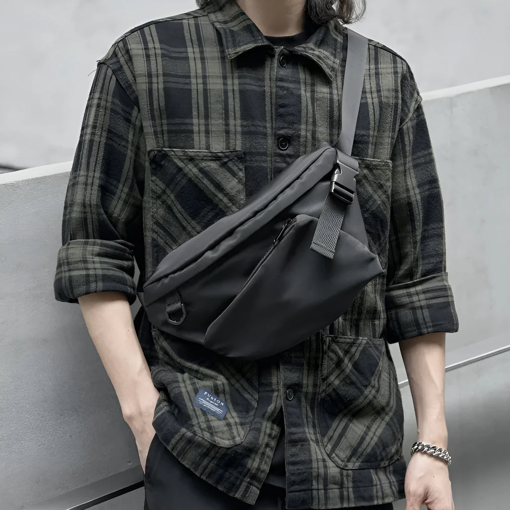 Black slanted chest bag showing sewing line details and 8-inch size