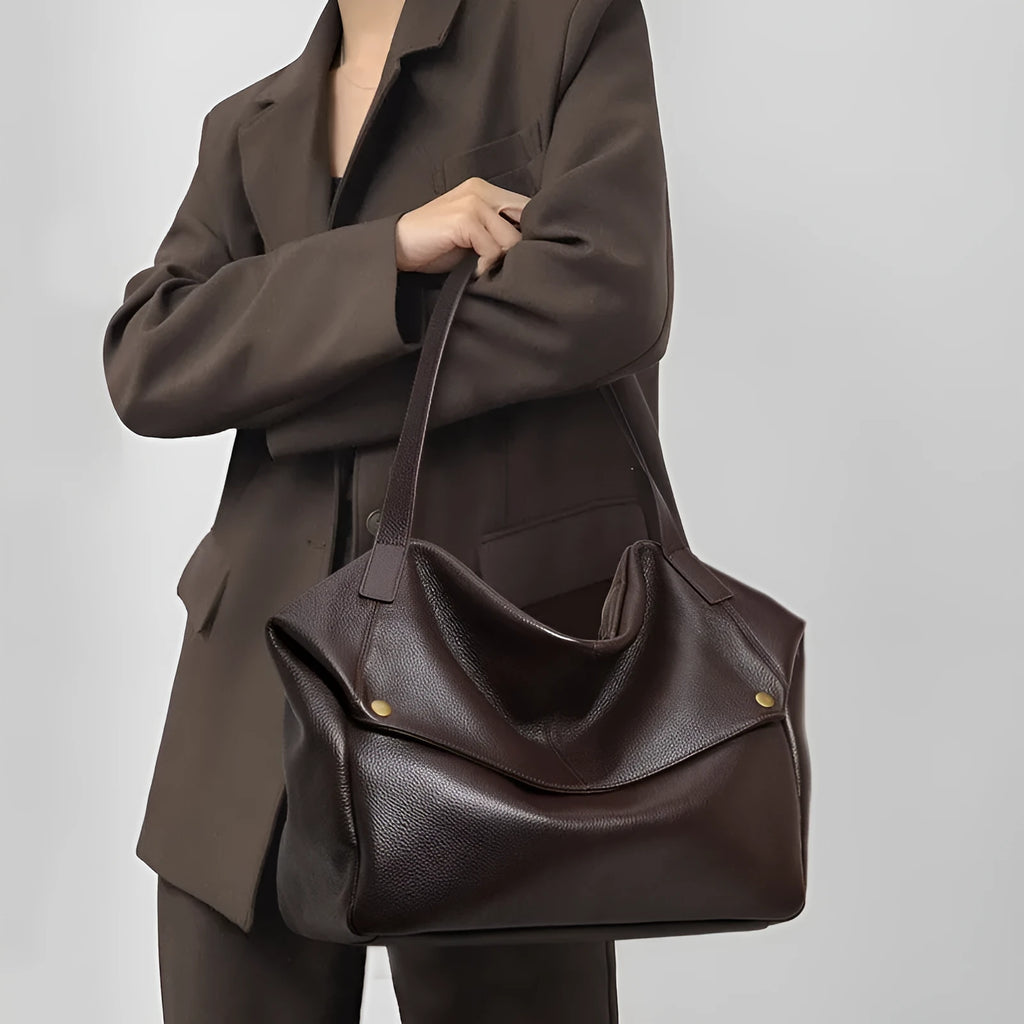 Brown genuine leather women's commuter shoulder bag with horizontal square shape showing zipper compartment