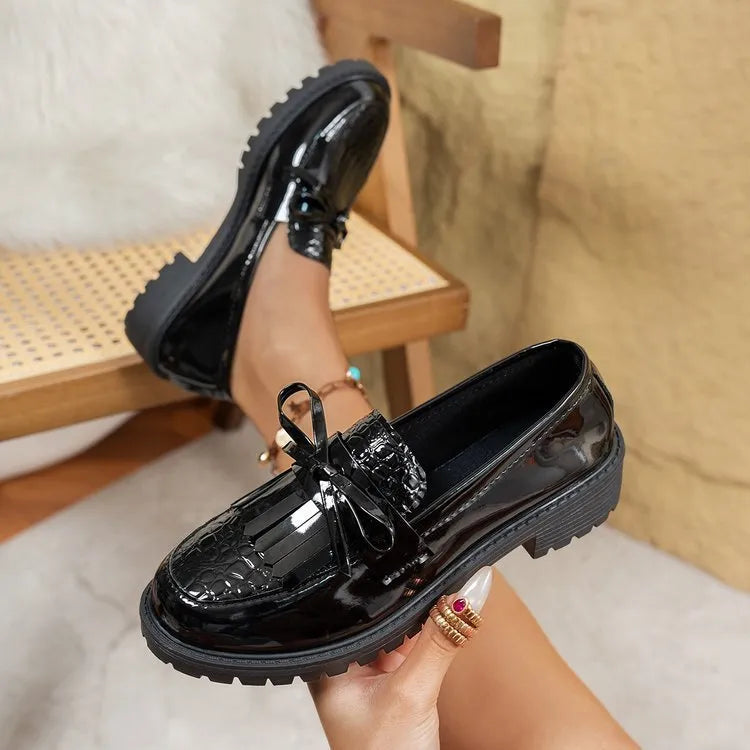 Women's brown and black bow detail loafers made from artificial PU, slip-on style.