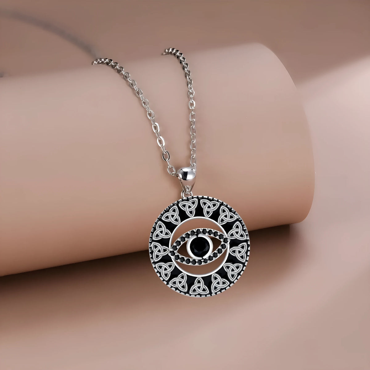 Copper necklace with a Devil's Eye pendant on a cross chain for women.