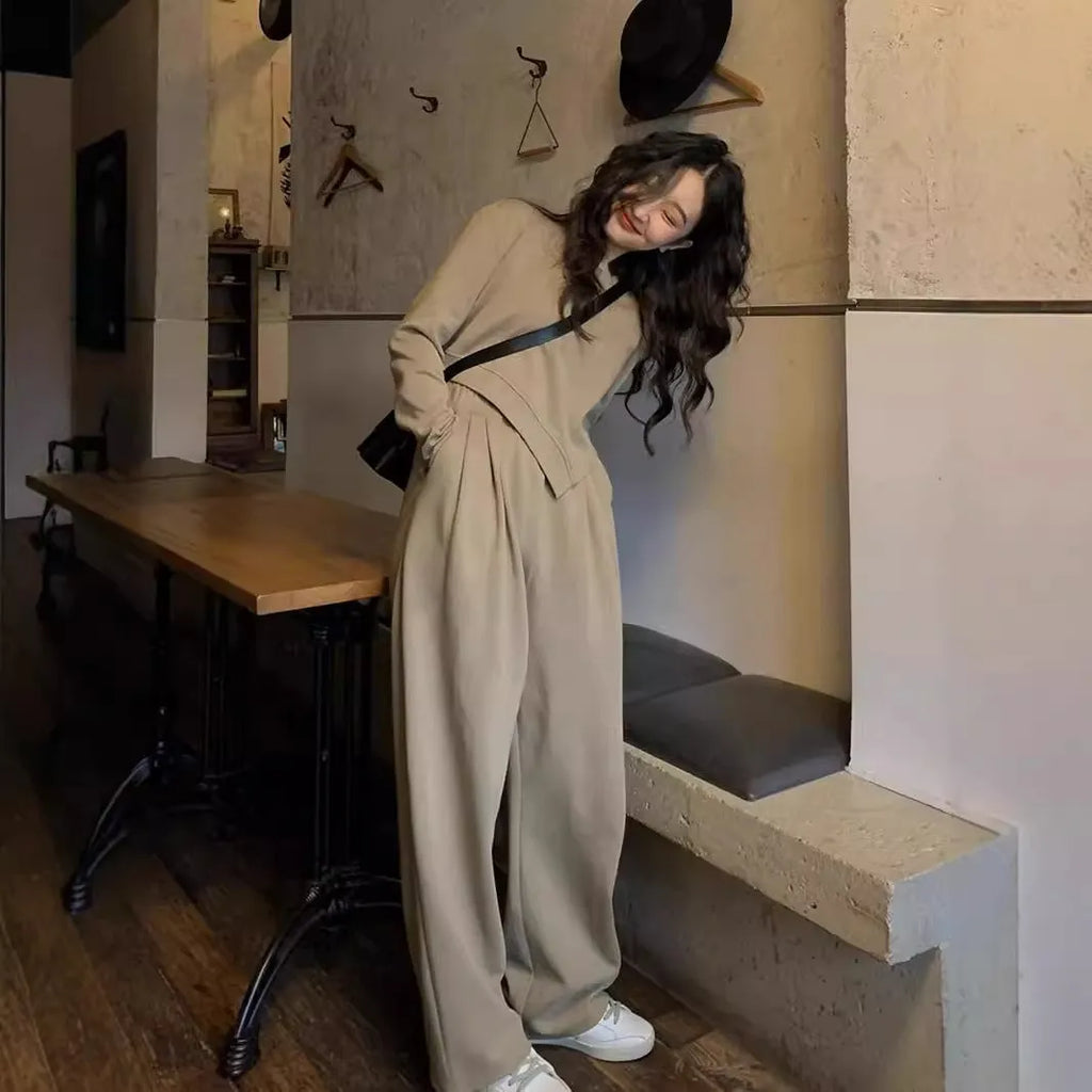 Women's casual sports suit set showing khaki coloured top and trousers with loose fit design