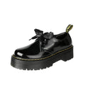 Women's black thick-soled lace-up shoes with white ribbon cross strap details on a superfine fibre upper.