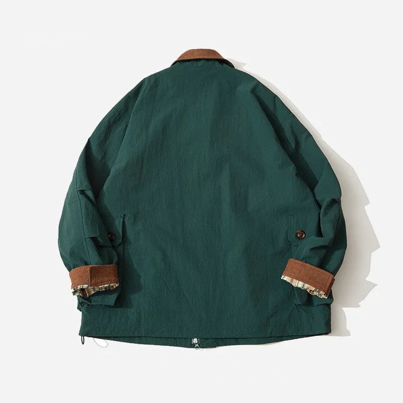 Green casual jacket with contrast trim and side seam pockets on a hanger