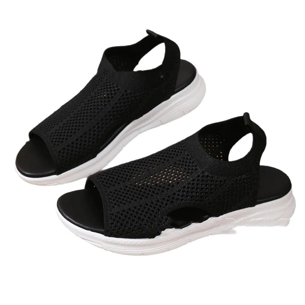 Women's beige platform sports sandals with a flat toe and rubber sole.