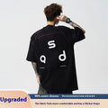 Loose fit cotton short sleeve t-shirt with letter print, shown in black and white colour options.