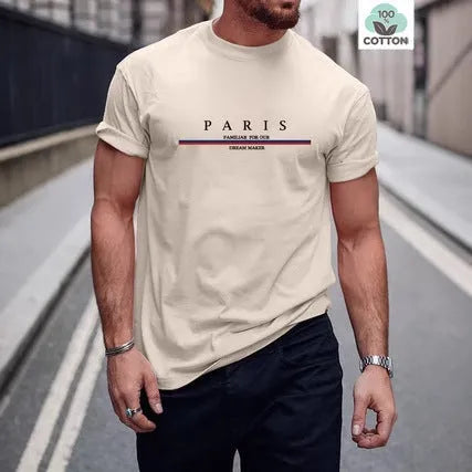 Man wearing a loose fit pure cotton t-shirt with a printed letter design on the front in apricot colour.