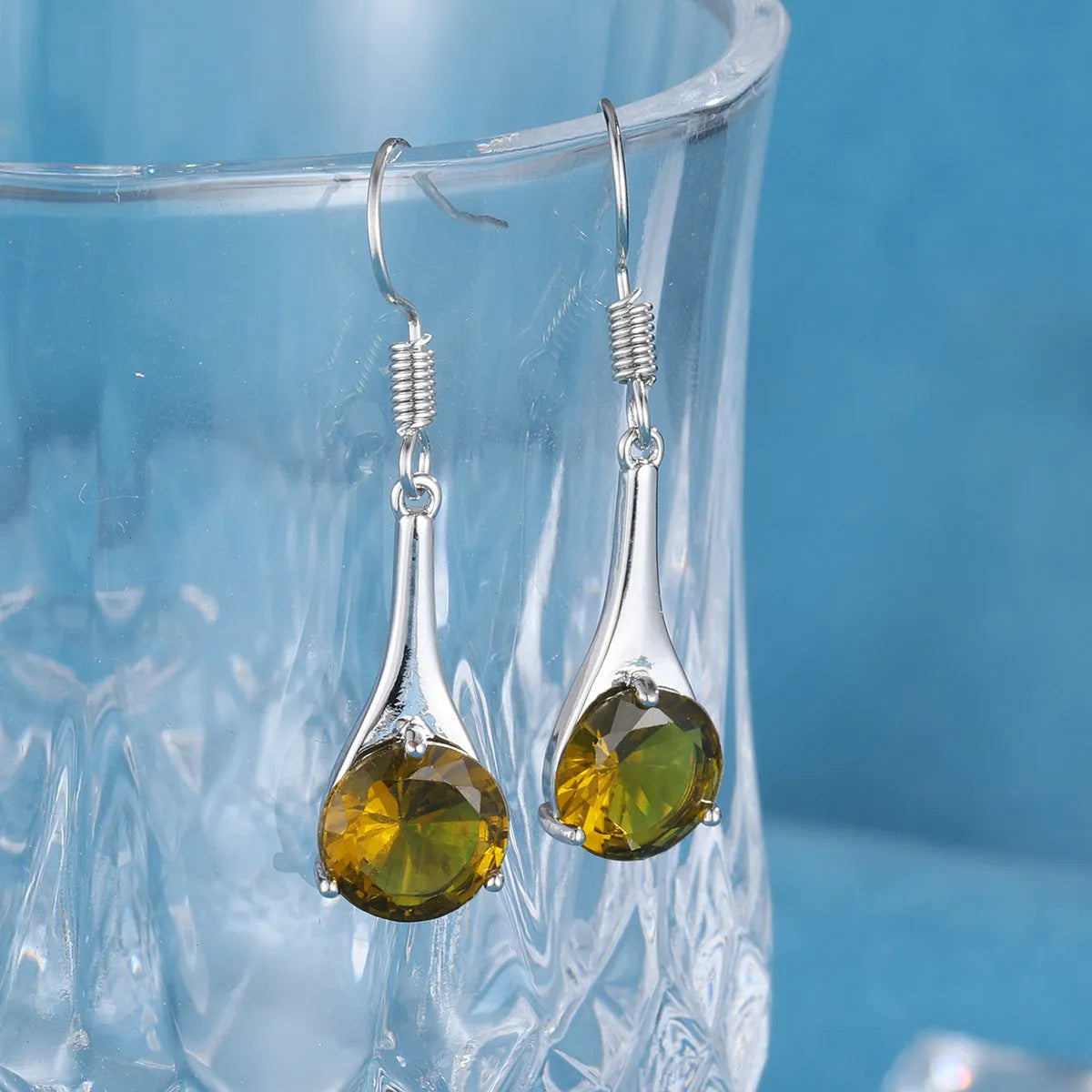 Olive green topaz water drop shaped earrings with minimalist retro design