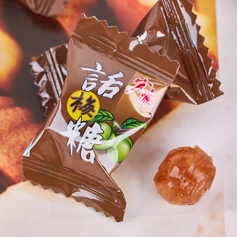 Assortment of guava, plum sugar, and tangerine peel hard candies in a gift pack bag.