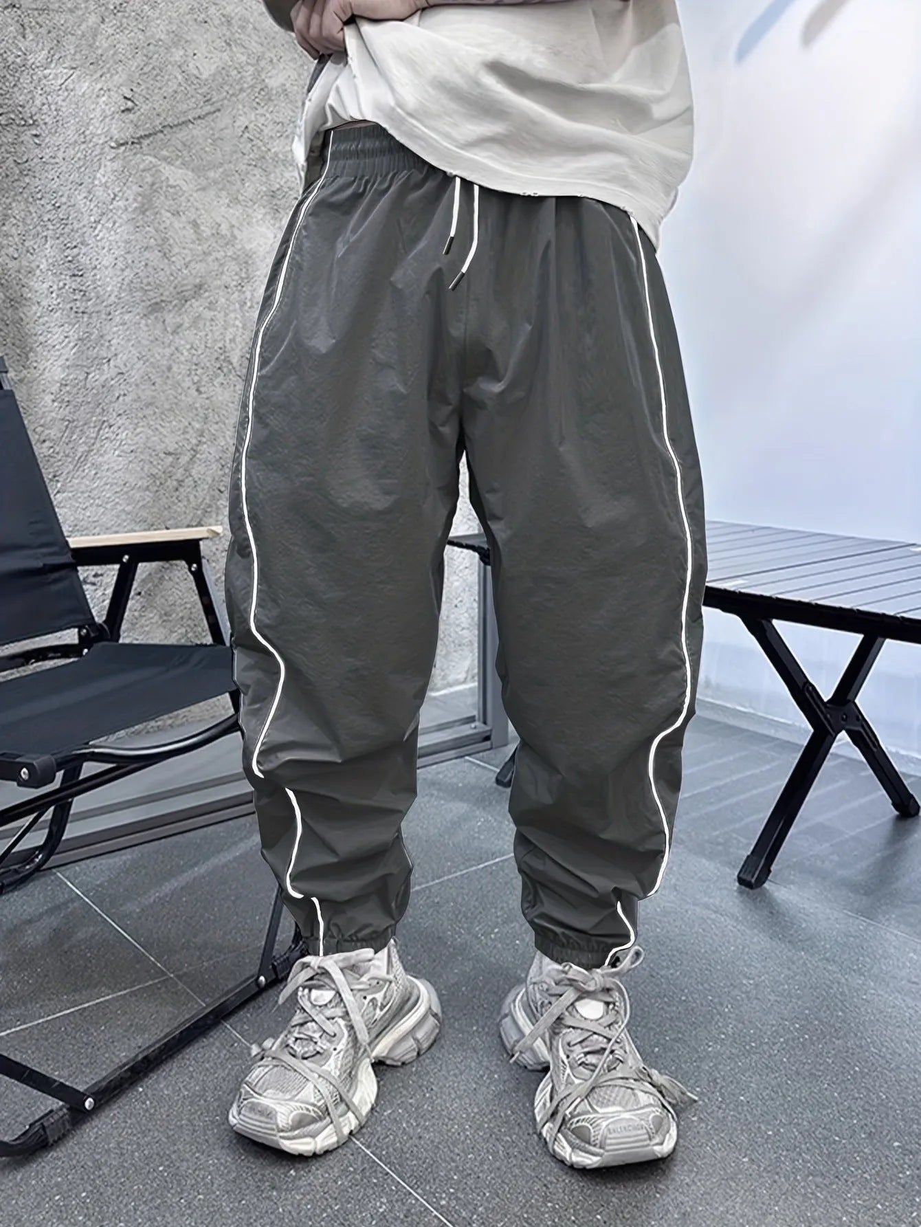 Men's loose fit bamboo fibre sports trousers in Army Green colour showing cropped length design
