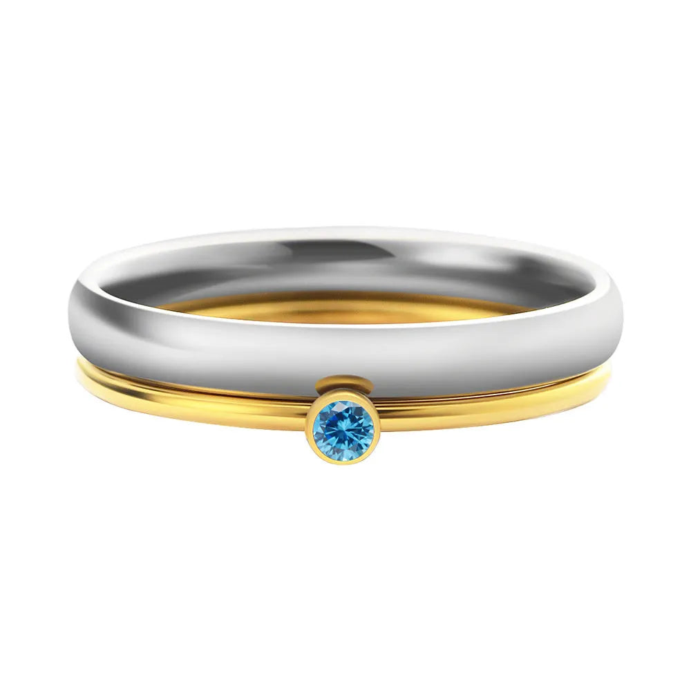 December birthstone engraved titanium steel ring with superimposed geometry design on a finger.