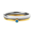 December birthstone engraved titanium steel ring with superimposed geometry design on a finger.