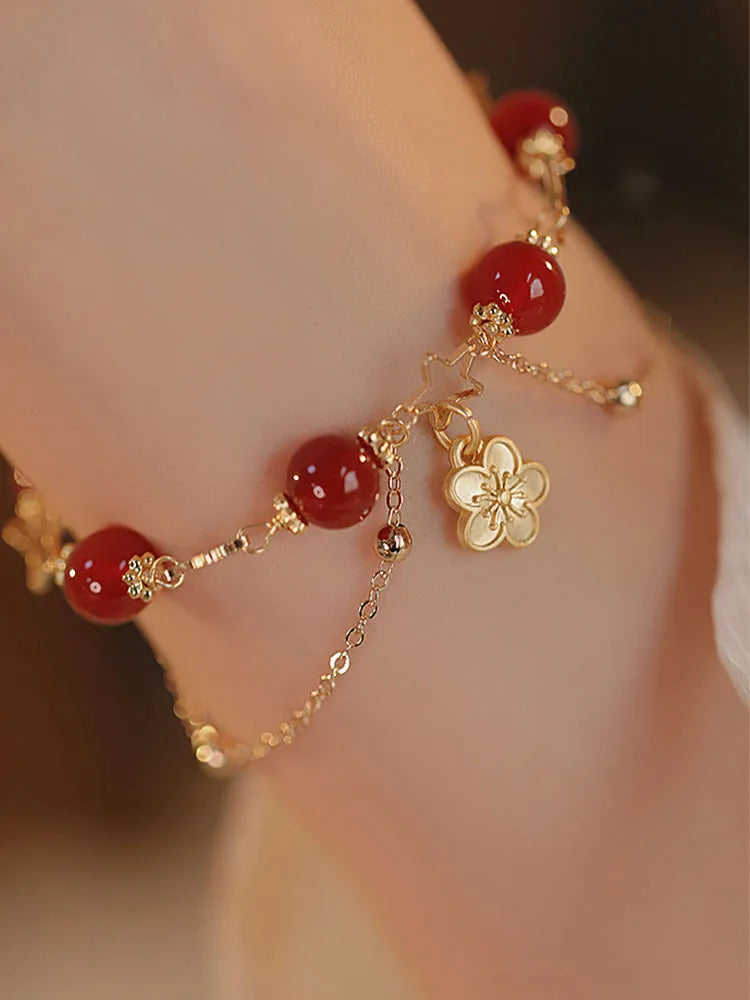 Red agate double layer bracelet for women with floral and peach blossom decorative elements.