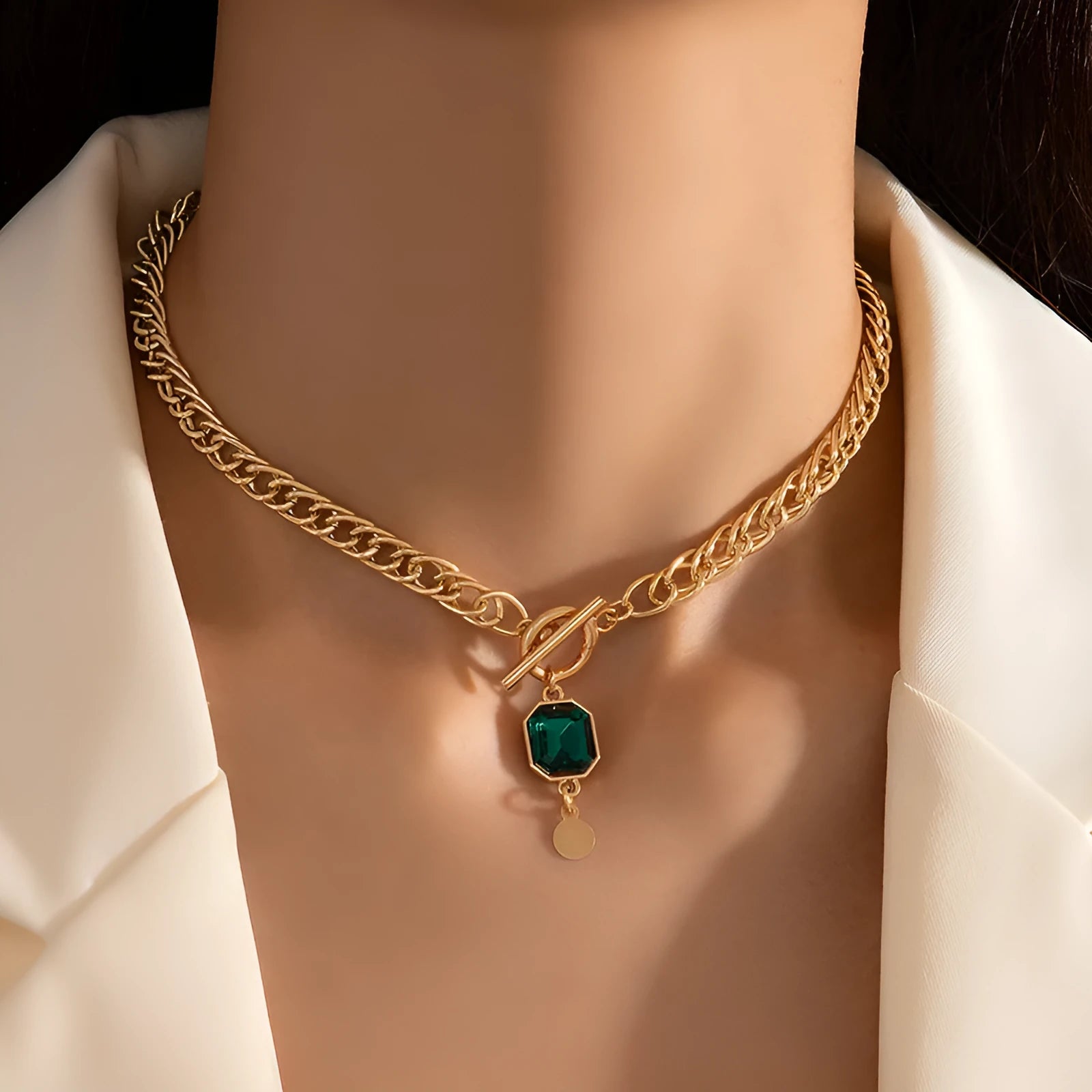 Gold retro pendant necklace with geometric round design and emerald zircon stone