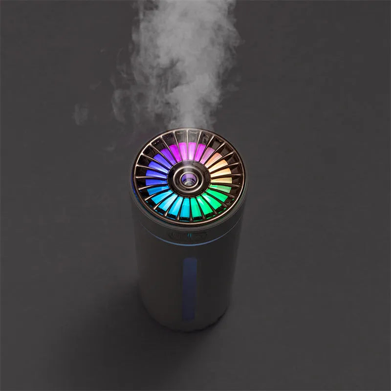 Black USB rechargeable ultrasonic humidifier with LED lights on a car cup holder