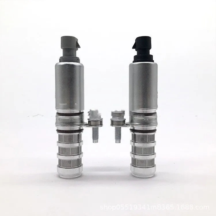 Pair of black metal VVT oil control solenoid valves for GM Buick and Chevrolet engines.