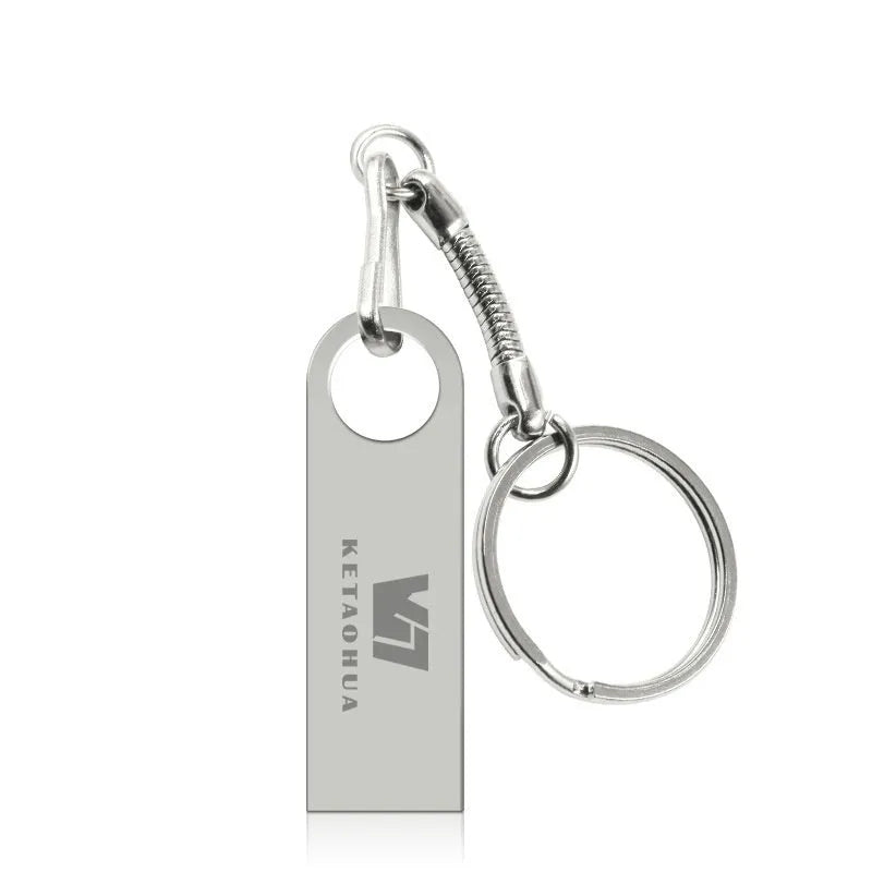Silver metal car-shaped USB flash drive on a white background showing front and side details.
