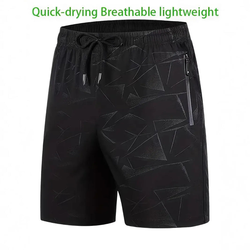 Man wearing loose black sports shorts made of polyester fabric, showing relaxed fit and elasticated waistband.