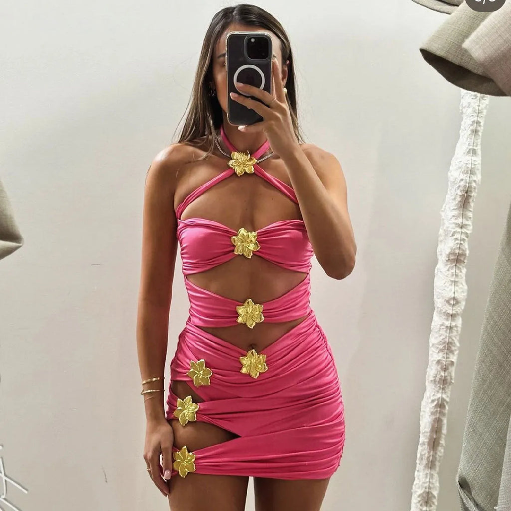 Women's solid colour one-piece swimsuit with hollow-out tube top and matching short skirt.