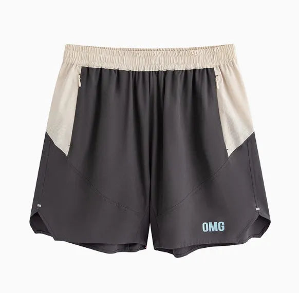 Man's loose grey workout shorts with elastic lace-up waistband, shown from side for gym use.