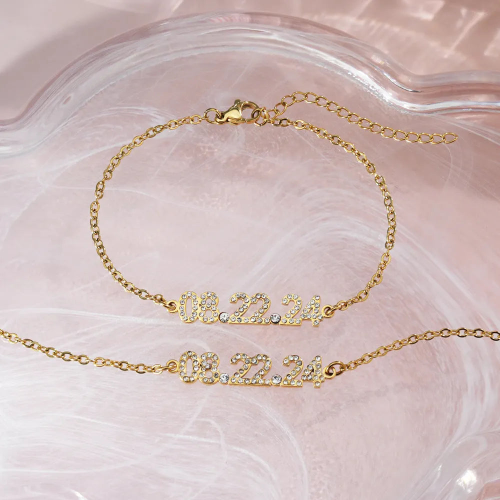 Stainless steel digital bracelet with diamond-set numbers, shown in gold, rose gold, and steel colour options.