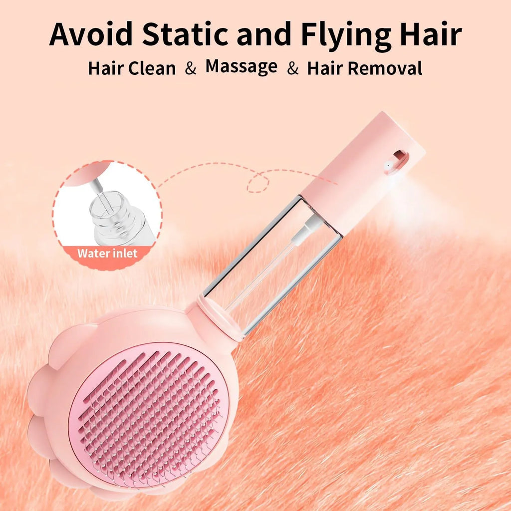 Grey spray cat brush with a release button and stainless steel bristles on a white background.