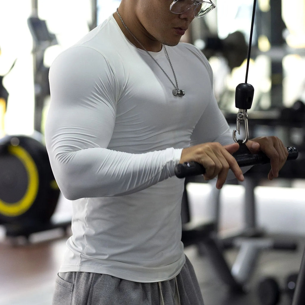 Men's black fitness tights with long sleeves for running and gym workouts