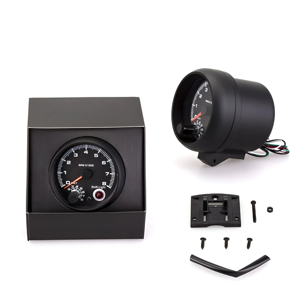 Black automotive tachometer with blue light pointer display showing RPM scale up to 8000.