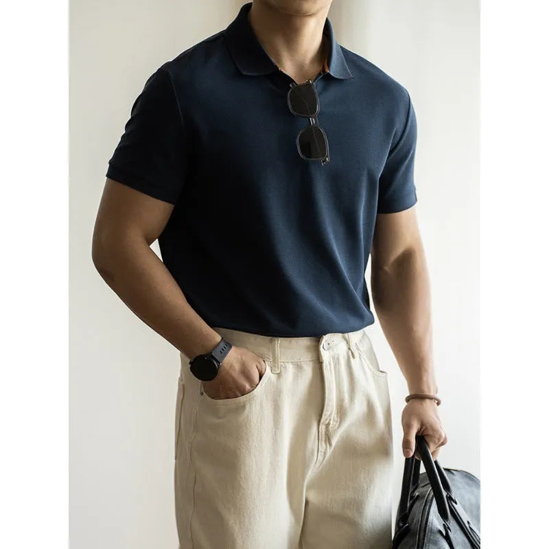 American-style short-sleeved polo shirt in a cotton-polyester blend, shown in blue, black, or white.