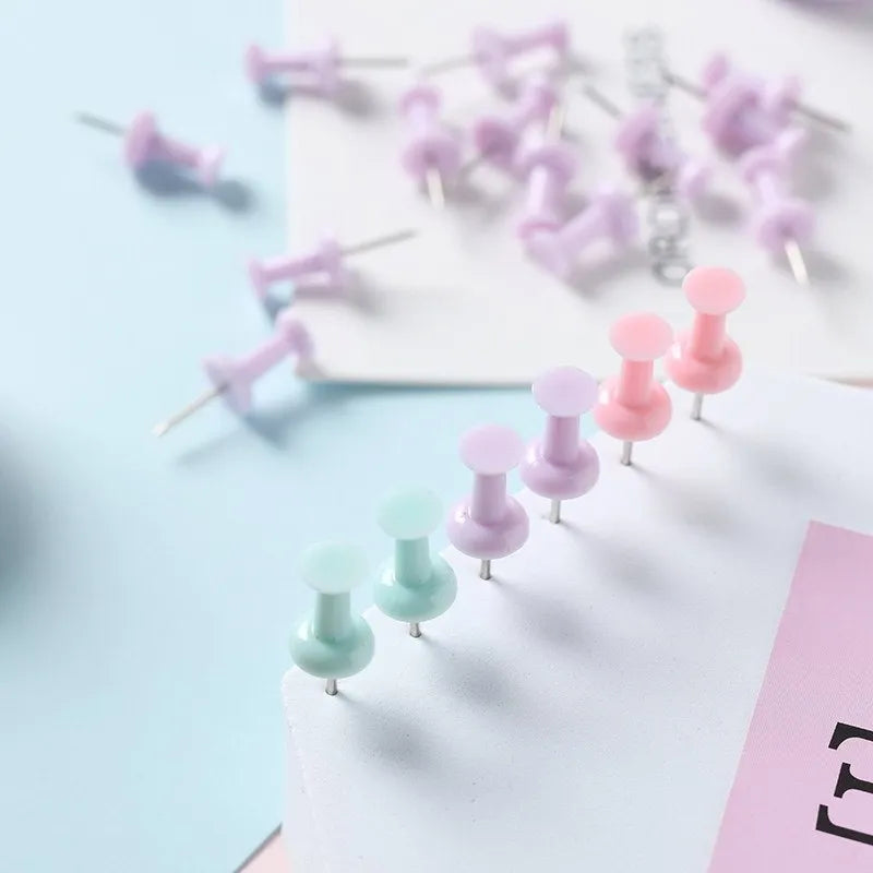 Plastic push pins in cherry blossom pink, mint green, and lavender colours showing large and small size options