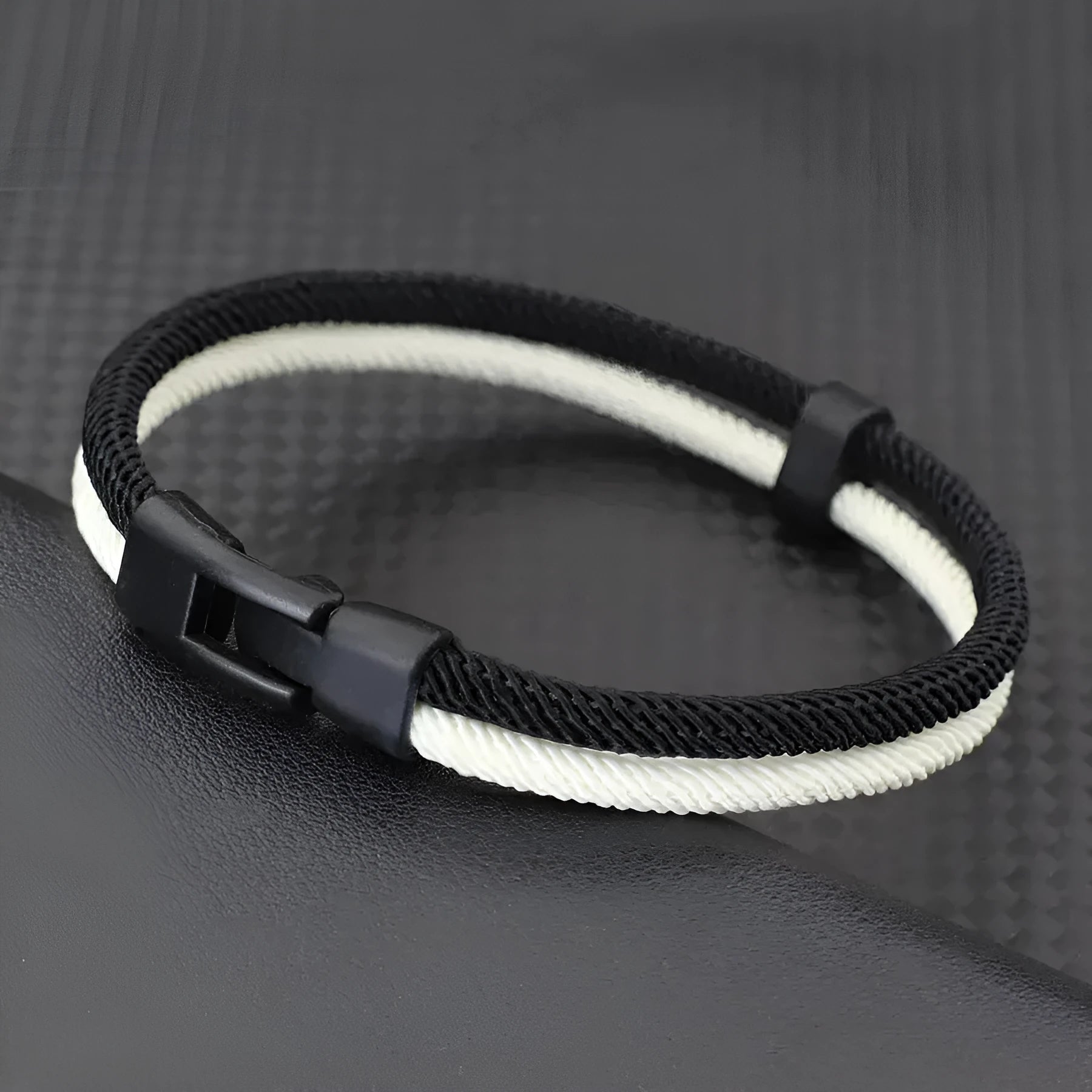 Handmade woven hand strap in Milan rope alloy available in black or white with 19cm, 21cm, or 23cm lengths