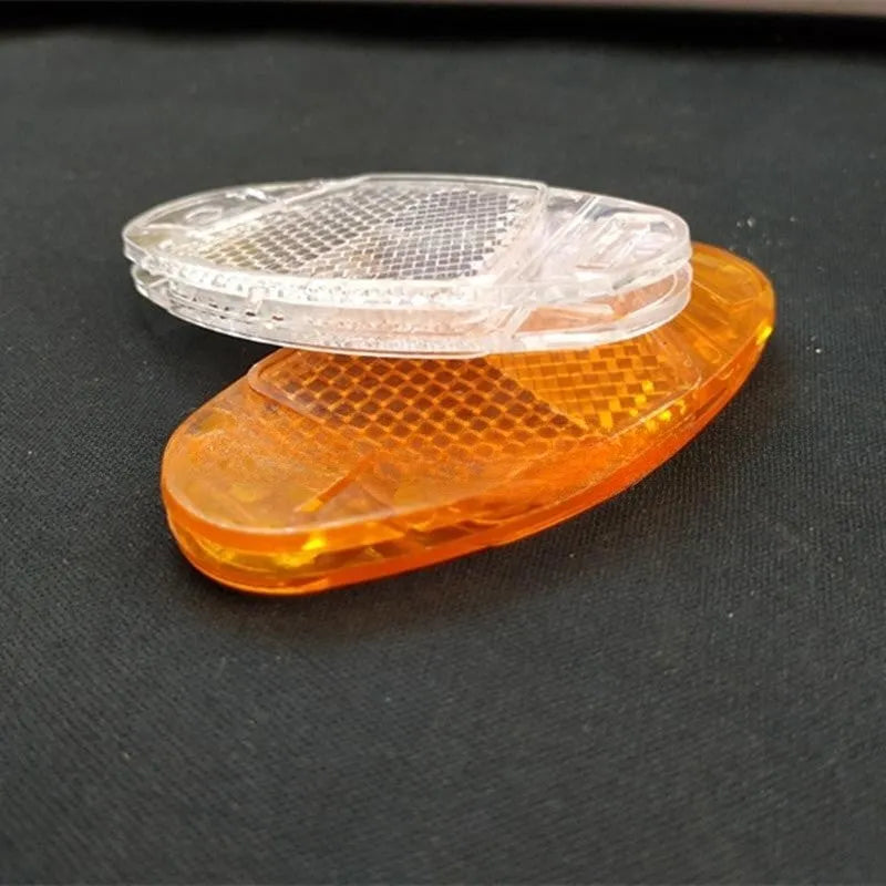 White and yellow bicycle spoke reflectors with plastic construction and night warning film