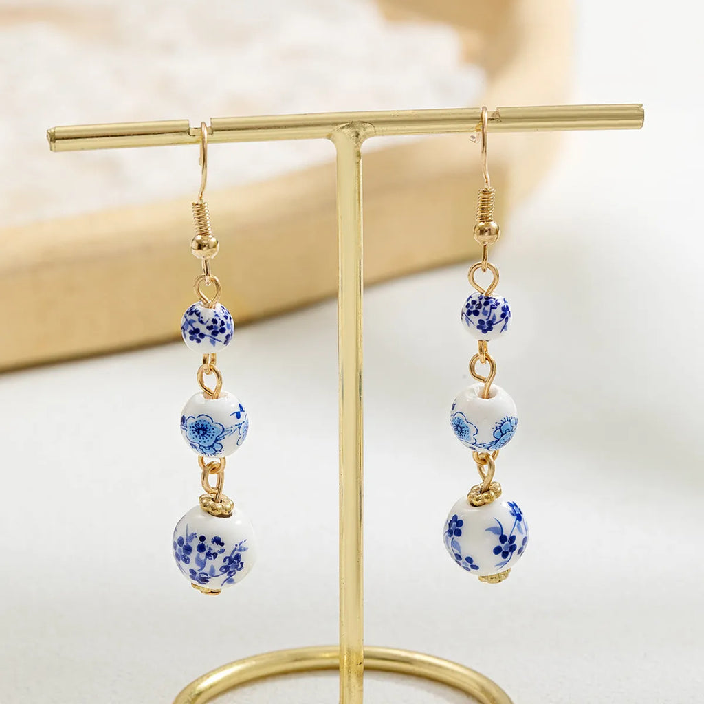 Blue and white porcelain ceramic bead long earrings with geometric alloy elements