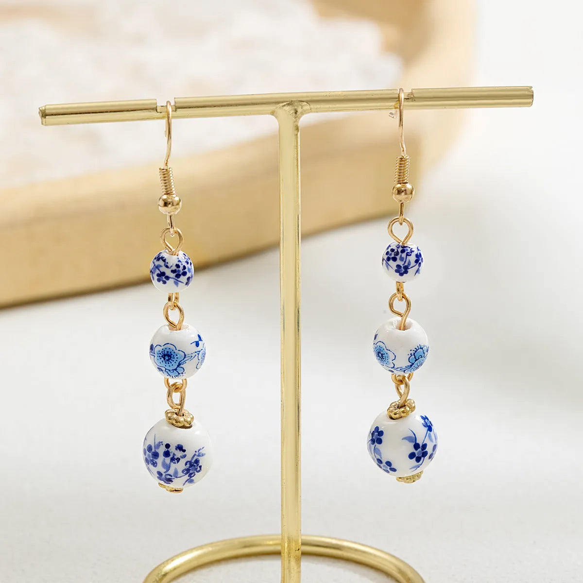 Blue and white porcelain ceramic bead long earrings with geometric alloy elements